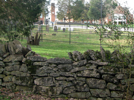Old fence and cemetary in front of the school