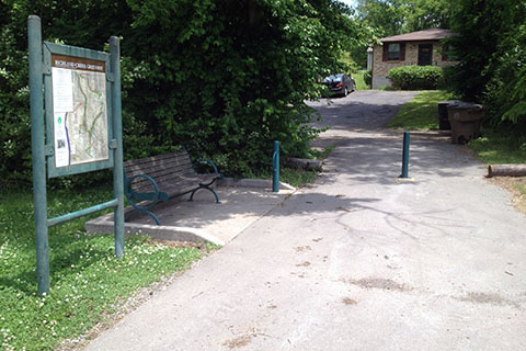 54th Ave N access - trail kiosk and bench