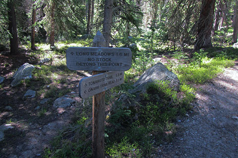 Trail sign to Long Meadow and directional sign to the Tonahutu Trail and Onahu Trailhead