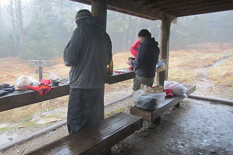 Cooking beneath the shelter