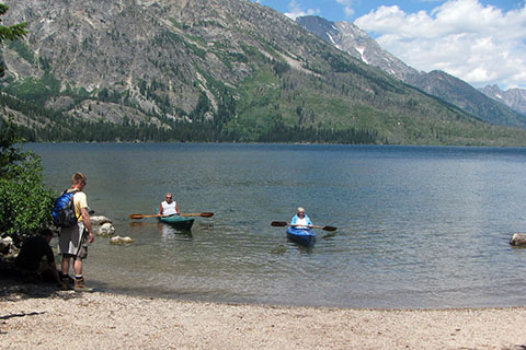 South Jenny Lake boat launch with a couple of kayaks in the lake