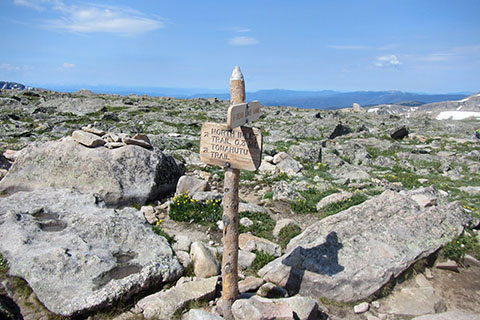 Directional sign at Flattop Mountain summit