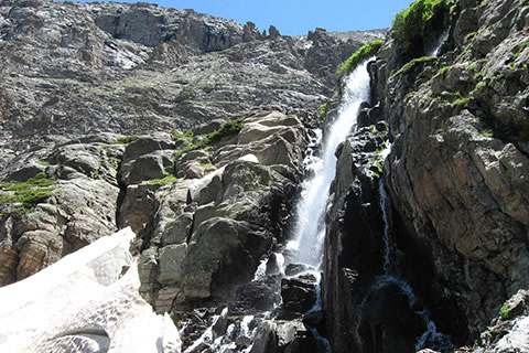 Timberline Falls cascading over rocks and snow